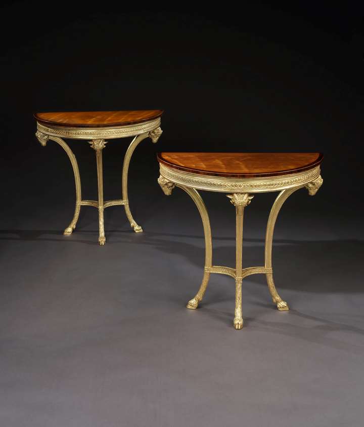A PAIR OF GEORGE III GILTWOOD AND SATINWOOD PIER TABLES
